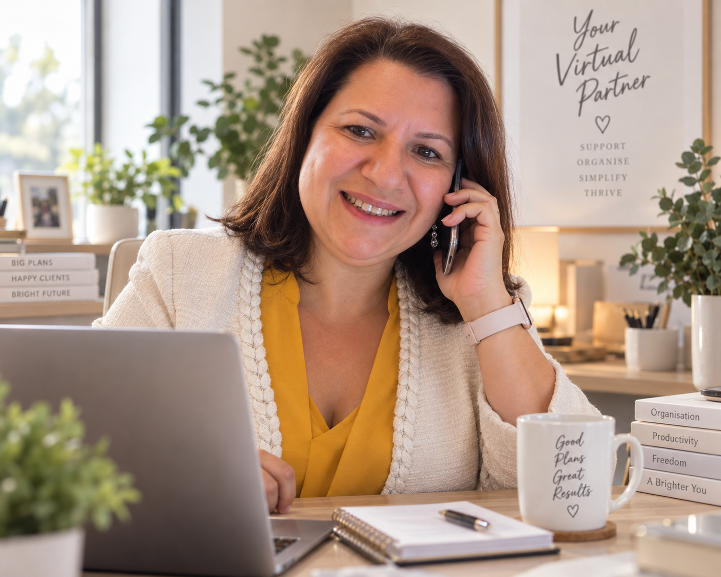 Anabela Grilo on a call in a bright home office